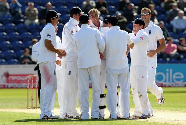 Stuart Broad (centre) is congratulated after dismissing Sri Lanka's Thisara Perera for his 100th wicket in Test cricket in 2011