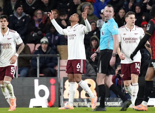 Gabriel raises his hands to the sky in celebration