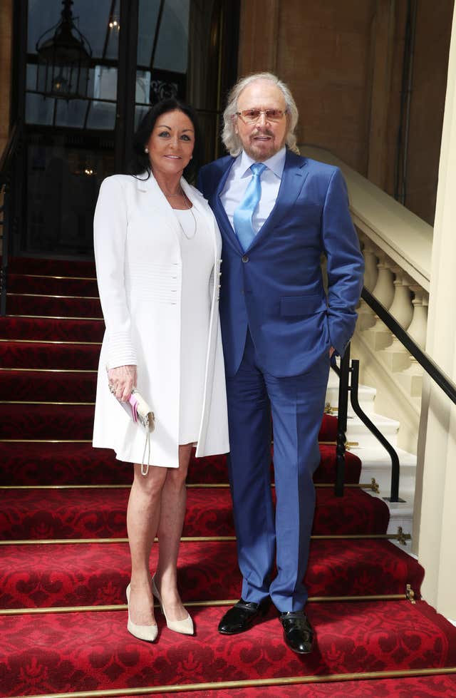 Barry Gibb with his wife Linda at Buckingham Palace