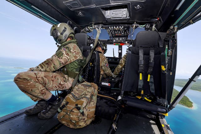 A Royal Navy Wildcat helicopter flying over Haiti after an earthquake hit the country (MoD/PA)