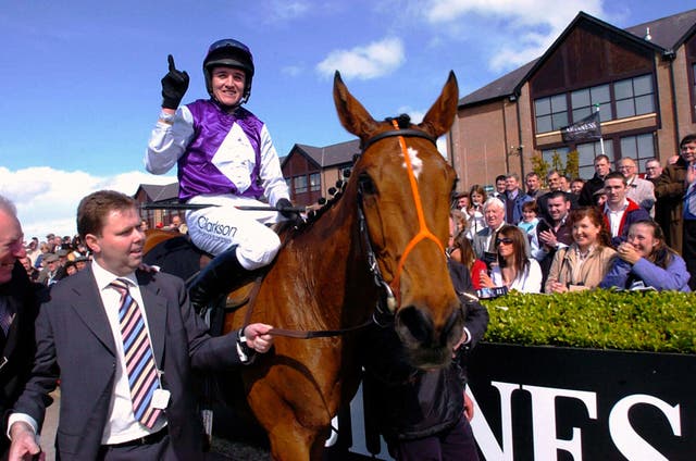 Barry Geraghty celebrates winning the Punchestown Gold Cup on Kicking King 