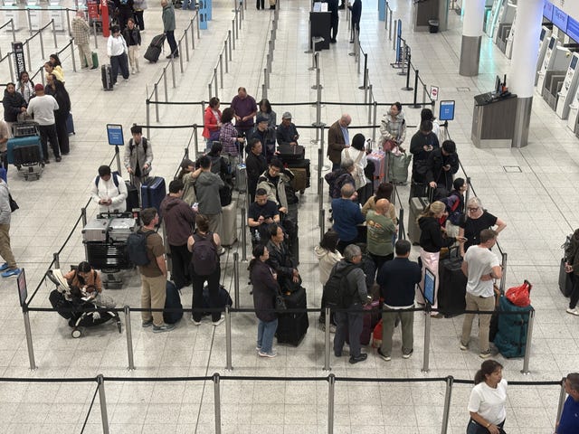 Passengers at Gatwick Airport’s South Terminal in Crawley, West Sussex, after flights were cancelled on Tuesday because of a UK air traffic control issue