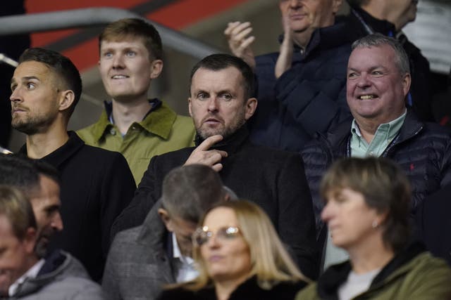 Nathan Jones (centre) watches on at St Mary's