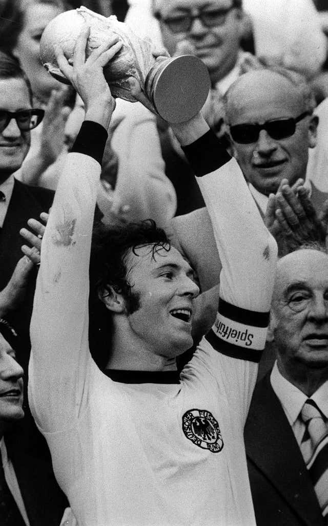 Franz Beckenbauer holds up the 1974 World Cup trophy
