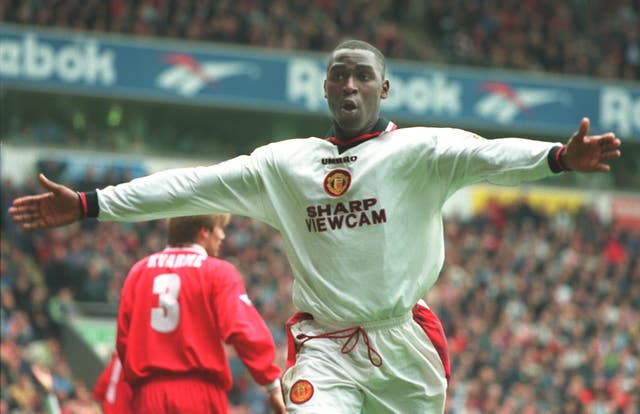 Manchester United's Andy Cole celebrates scoring in a 3-1 win over Liverpool at Anfield in 1996-97