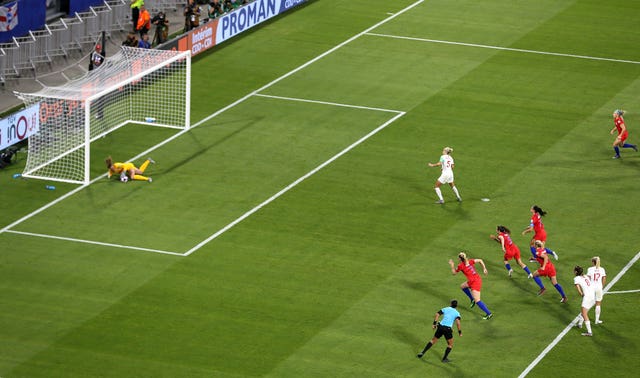 Steph Houghton, centre, sees her penalty saved by USA goalkeeper Alyssa Naeher