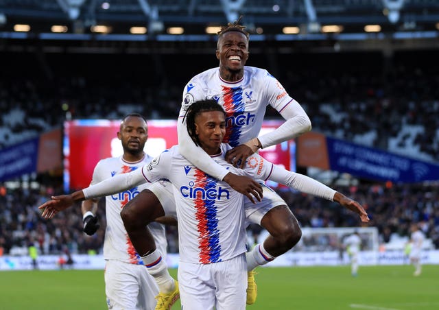 Crystal Palace’s Michael Olise (bottom) celebrates with Wilfried Zaha after scoring a late winner at West Ham