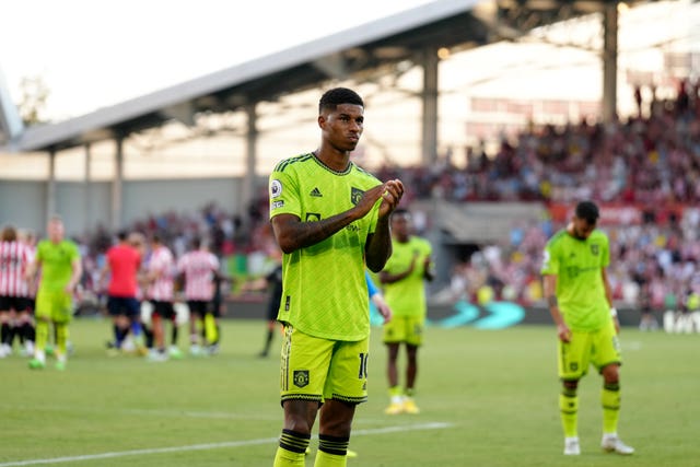 Marcus Rashford looks unhappy as he applauds supporters