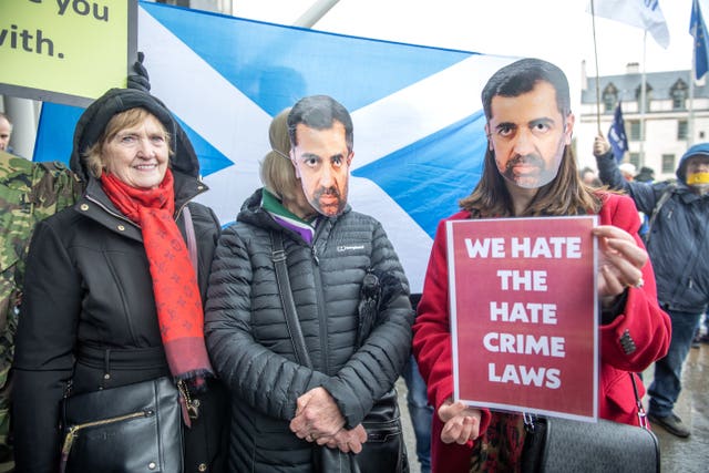Campaigners gather outside the Scottish Parliament at Holyrood