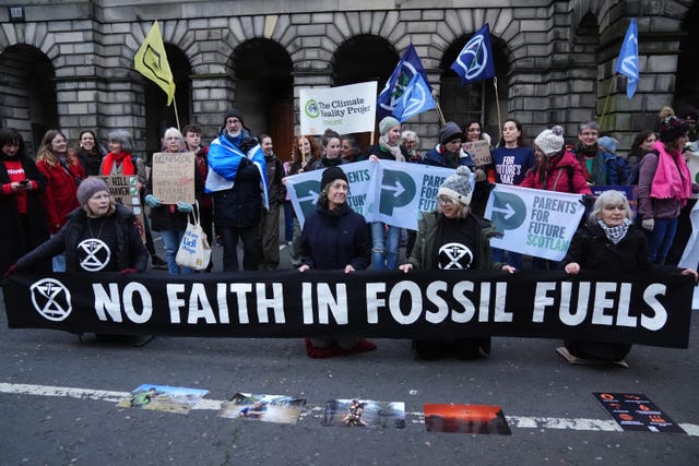 Rosebank and Jackdaw protesters outside the Court of Session in Edinburgh waving signs