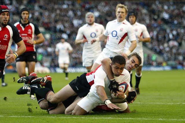 Robinson scores a try against Canada (David Davies/PA).