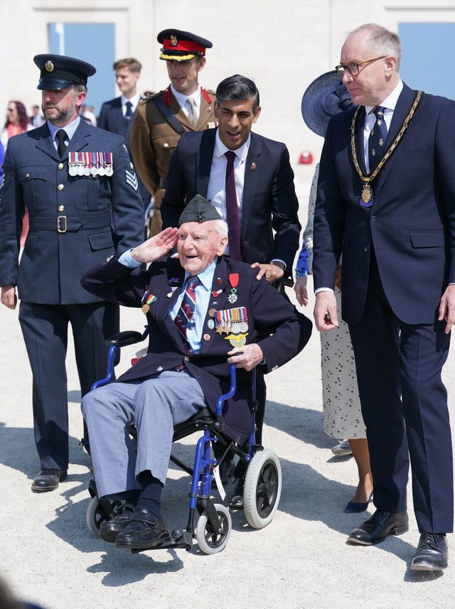  Prime Minister Rishi Sunak wheels a D-Day veteran Bernard Morgan, 100, on the 80th anniversary of D-Day