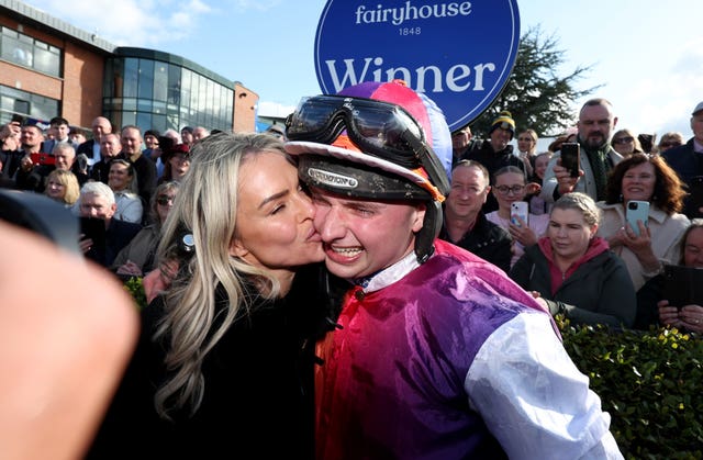 A kiss for winning jockey Sean Bowen from trainer Rebecca Curtis