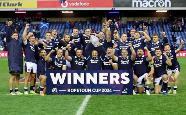 Scotland’s players celebrate on the pitch after winning the Hopetoun Cup after beating Australia