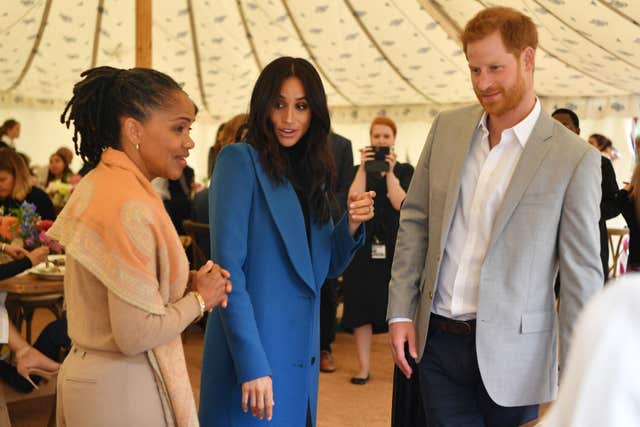 Meghan and Harry with the duchess' mother Doria Ragland who has been a presence in Archie's life. Ben Stansall/PA Wire
