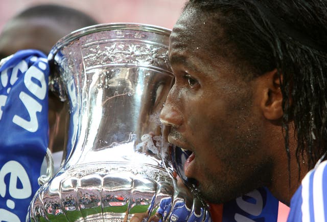 Chelsea’s Didier Drogba kisses the trophy