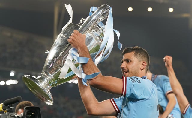 Manchester City’s Rodri celebrates with the Champions League trophy in 2023