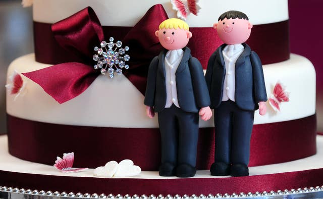 Groom cake decorations on a wedding cake