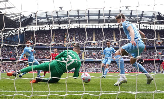 Manchester City retain slender lead after thrilling draw with rivals Liverpool