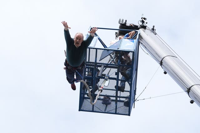 Sir Ed Davey takes part in a bungee jump