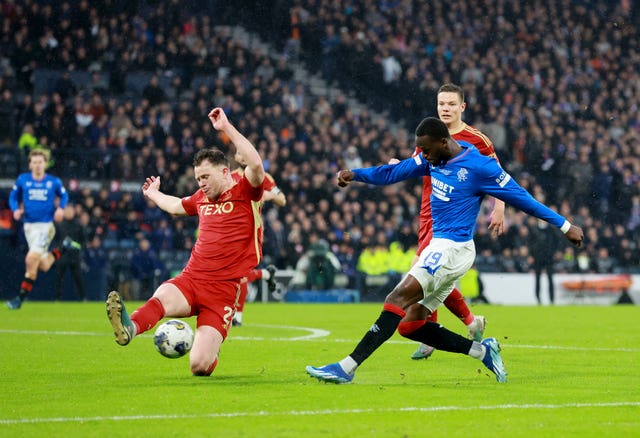 Rangers'' Abdallah Sima, right, has a shot on goal charged down by Aberdeen''s Nicky Devlin, left, during the Viaplay Cup final