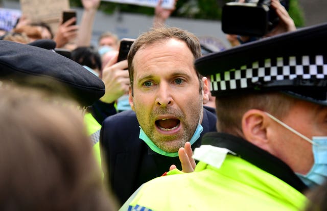 Petr Cech attempts to speak to fans protesting outside Stamford Bridge 