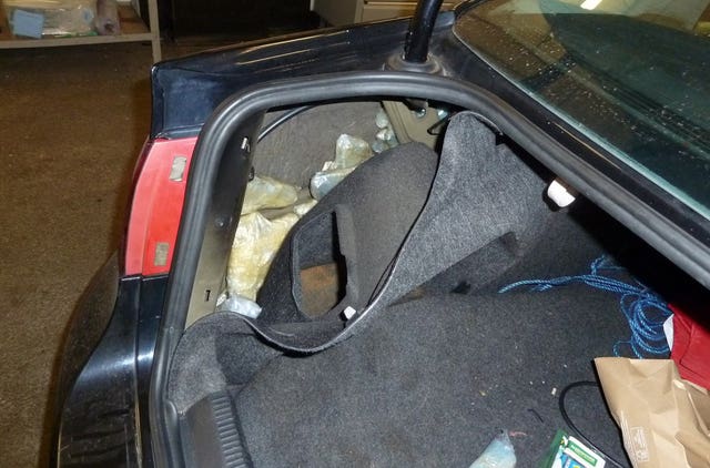 The hiding place of some of the firearms in the car