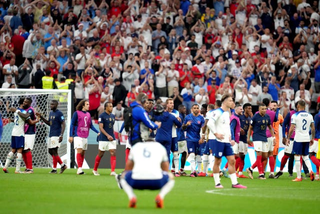 England’s Harry Kane (centre) is dejected at the end of the World Cup quarter-final defeat by France
