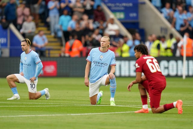 Players taking the knee at Saturday's match (Nick Potts/PA).