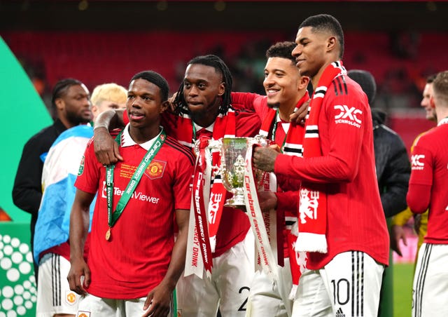 Manchester United’s Tyrell Malacia, Aaron Wan-Bissaka, Jadon Sancho and Marcus Rashford, left to right, celebrate last season's Carabao Cup win
