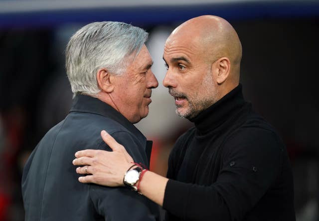 Manchester City Manager Pep Guardiola with Real Madrid Chief Coach Carlo Ancelotti (left) 