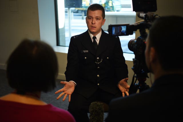 Pc Stuart Outten speaking to the media at New Scotland Yard in London