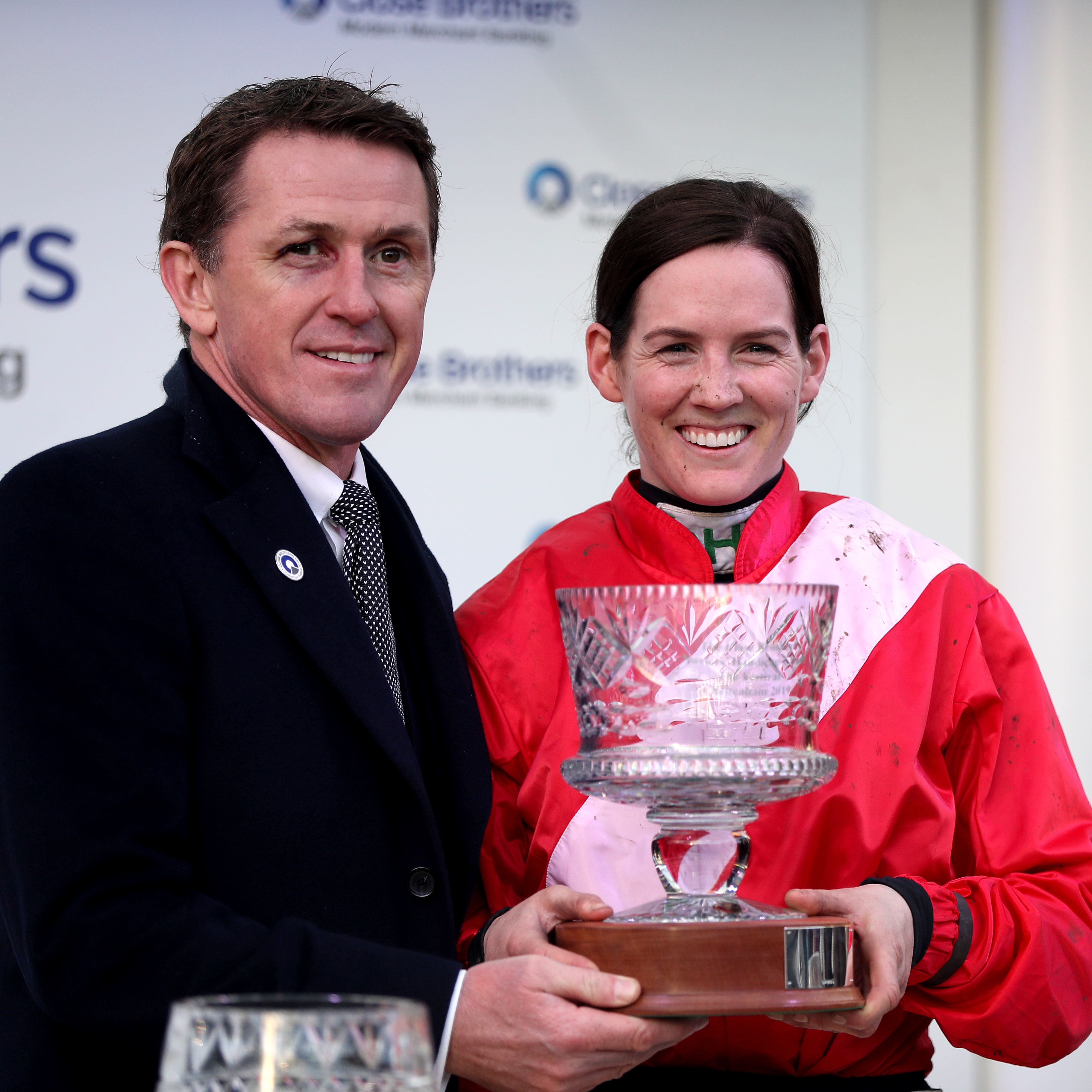 Rachael Blackmore is presented with her trophy by AP McCoy after winning the Close Brothers Novices’ Handicap Chase on A Plus Tard