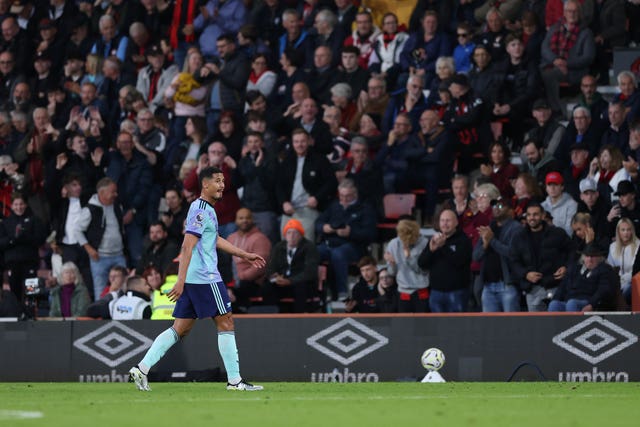 Arsenal defender William Saliba walks off the pitch after receiving a red card against Bournemouth