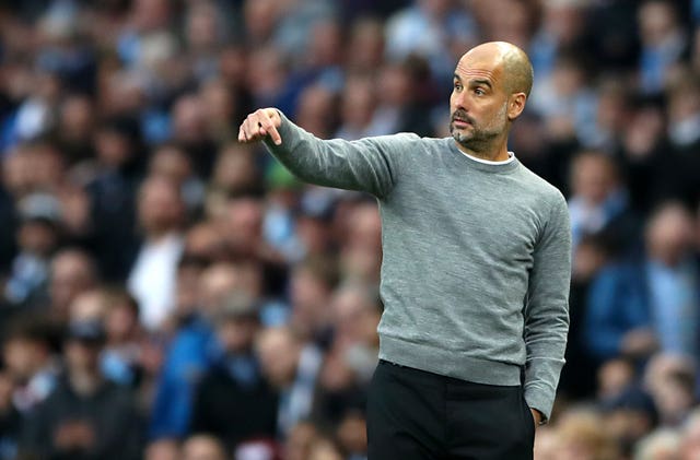 Manchester City manager Pep Guardiola gestures during the defeat to United