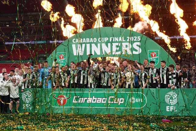 Newcastle United’s Bruno Guimaraes and Kieran Trippier lift the Carabao Cup trophy