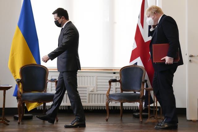 Ukrainian President Volodymyr Zelenskyy attends a meeting with Prime Minister Boris Johnson at the Munich Security Conference