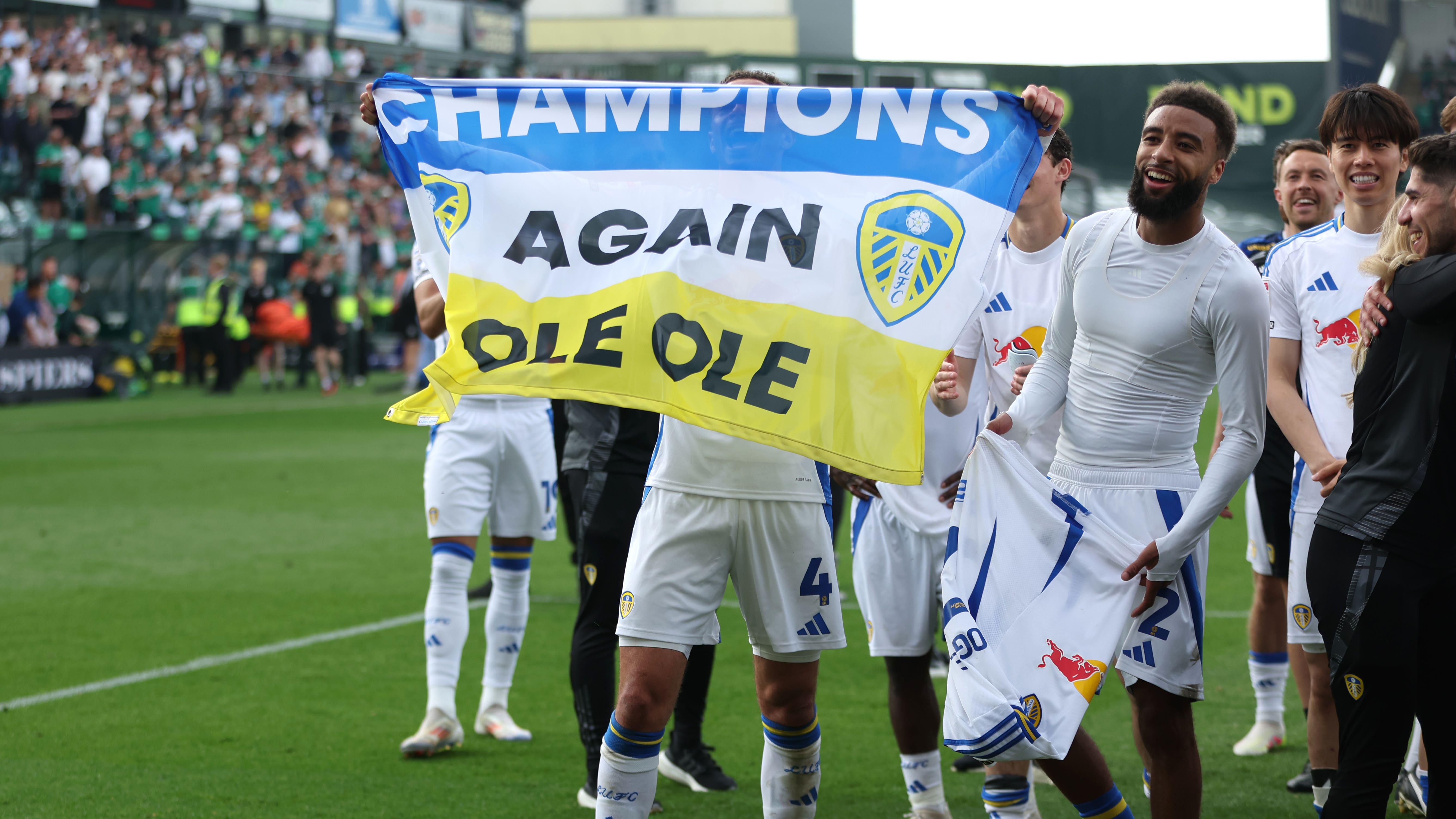 Leeds’ players celebrate the title (Steven Paston/PA)