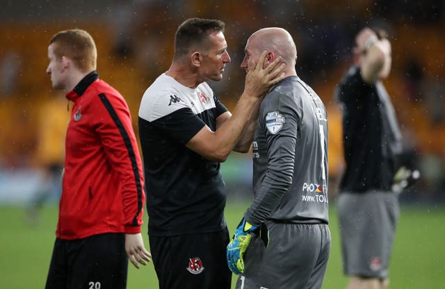 Crusaders manager Stephen Baxter consoles goalkeeper Sean O'Neill