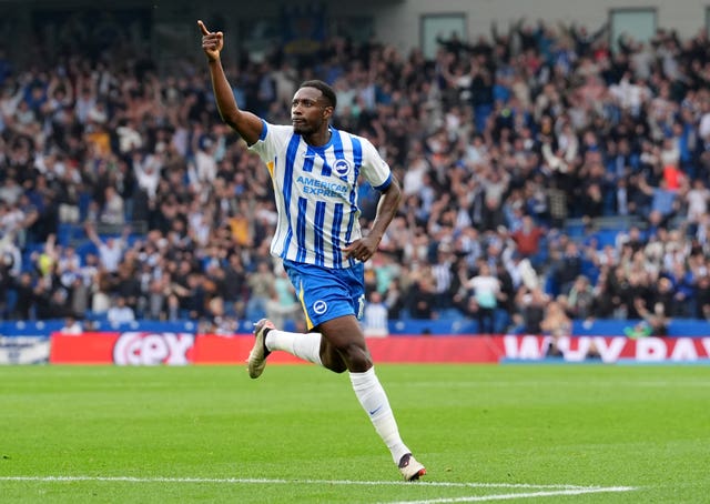 Brighton's Danny Welbeck raises his arm to celebrate scoring a goal against Nottingham Forest