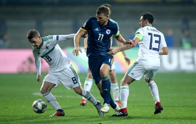 Edin Dzeko, centre, scored the goals to down Northern Ireland