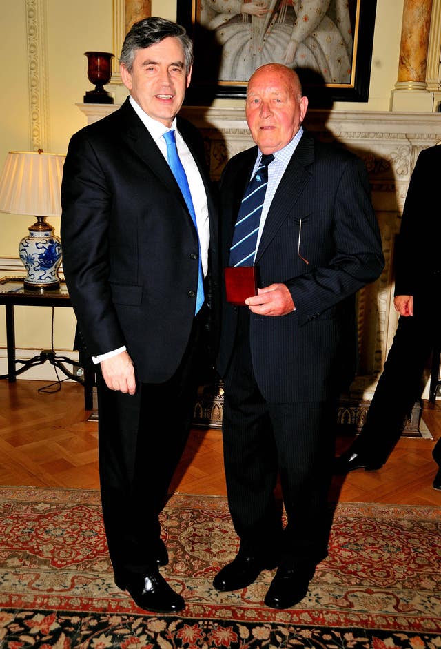 Ron Springett collects his World Cup medal from Prime Minister Gordon Brown