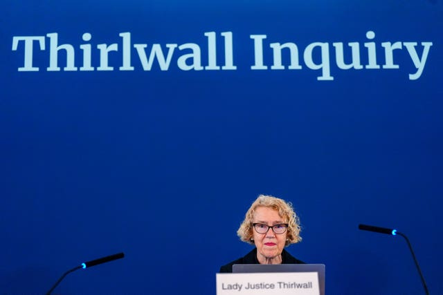 Lady Justice Thirlwall at Liverpool Town Hall with a Thirlwall Inquiry sign in the background