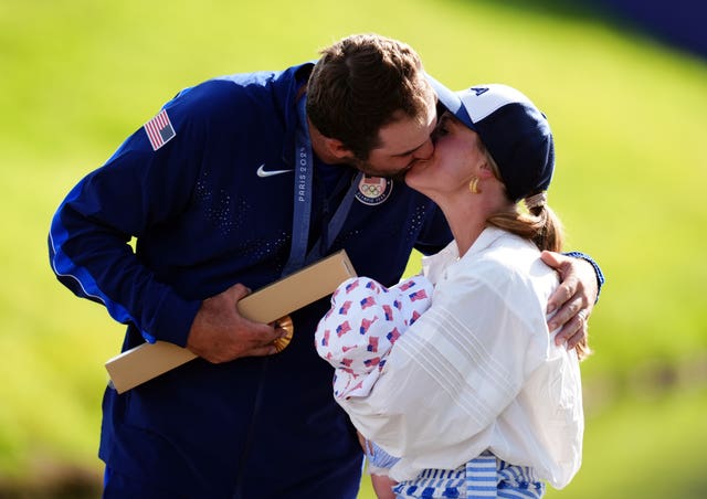 Scottie Scheffler with his wife and son