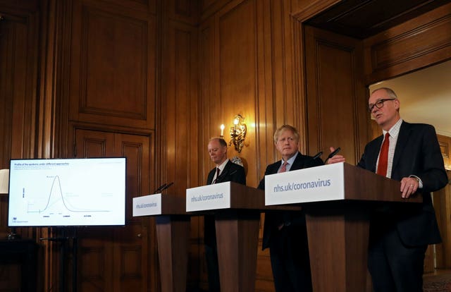 Prime Minister Boris Johnson alongside chief medical officer for England Chris Whitty, left, and chief scientific adviser Sir Patrick Vallance, right, during a press conference at 10 Downing Street 