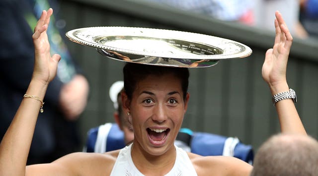 Muguruza celebrates her Wimbledon title