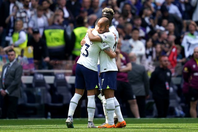 Lucas Moura hugs team-mate Pedro Porro at the end of one of his final appearances for Tottenham