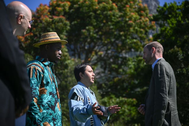 Prince of Wales talking to three people