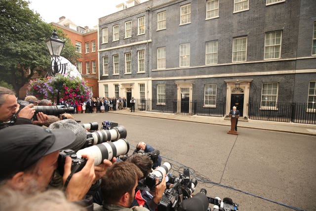 Prime Minister Boris Johnson reads a statement outside 10 Downing Street