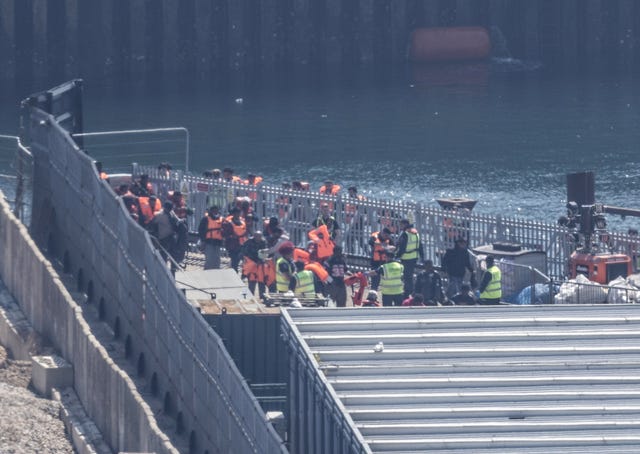 A group of people thought to be migrants at the Border Security Command compound in Dover